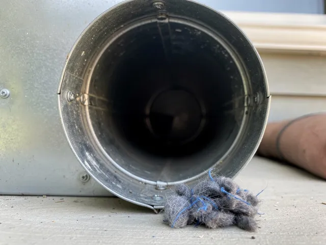 Hartford Dryer Vent Cleaning technician using specialized equipment to clear severe dryer vent blockage in Hartford